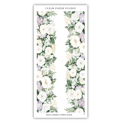 A floral arrangement with white and purple flowers, along with greenery, displayed on a white background.