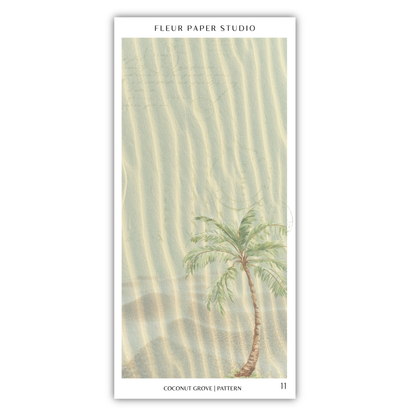 A palm tree with green leaves stands in the sand, creating a serene and tropical scene.