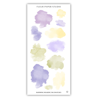 a collection of 12 watercolor paint splatter designs in various pastel colors, including shades of purple, yellow, and green.