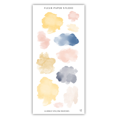 a collection of abstract watercolor brush strokes in various colors, including yellow, pink, blue, and gray. The text "FLÉR PAPER STUDIO" is visible, indicating the source or brand of the image.